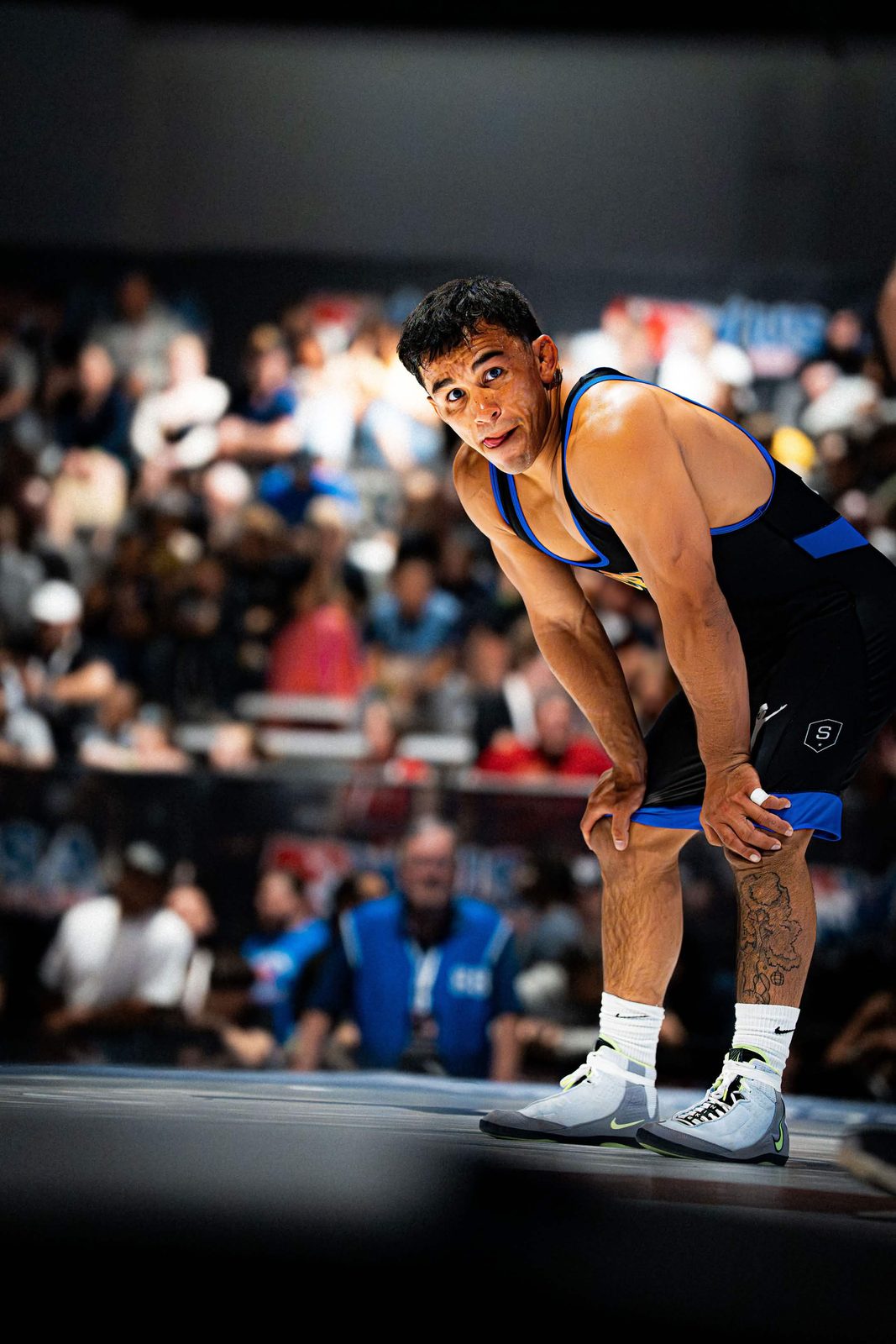 Peyton Omania celebrating a win in an OCRTC singlet