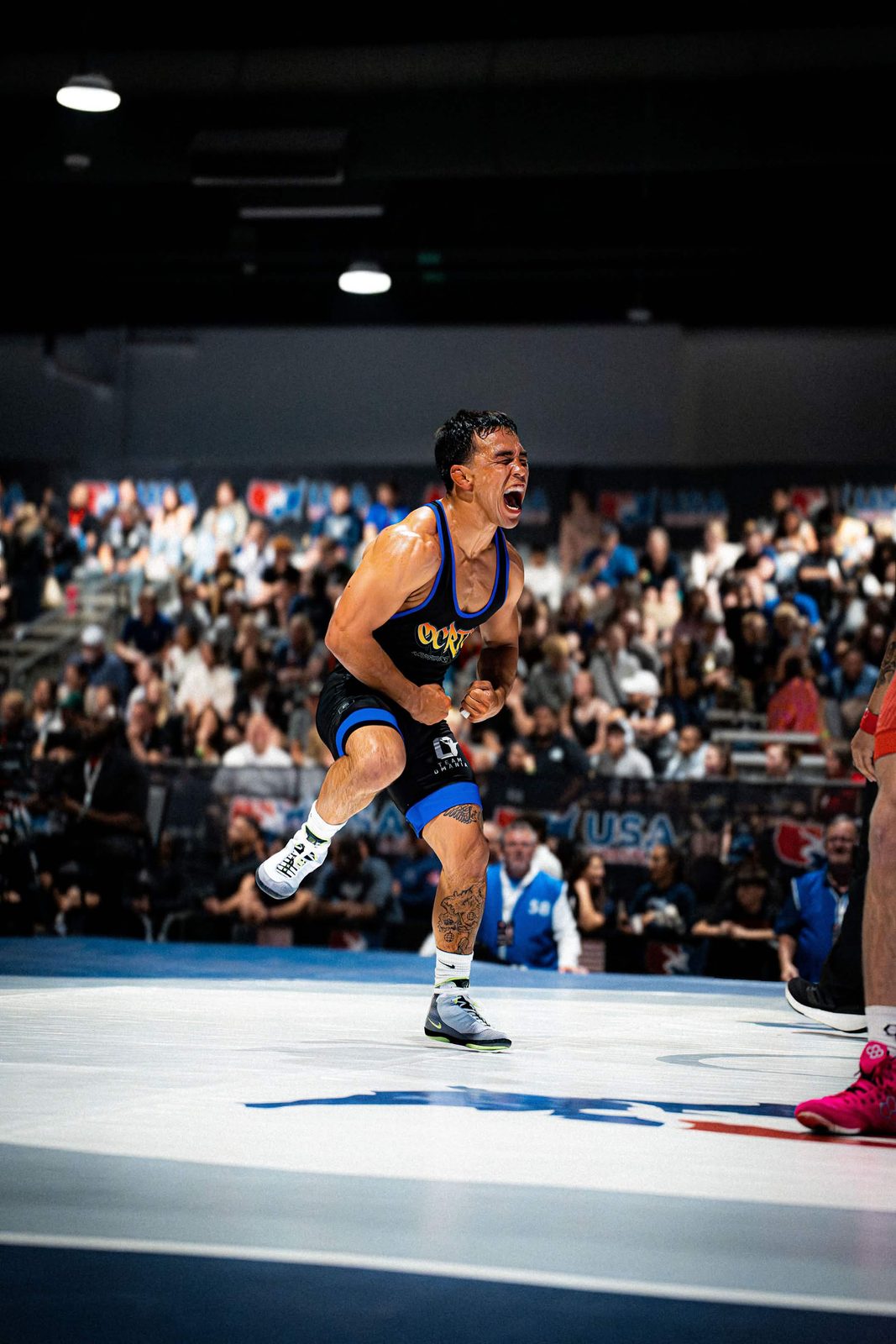 Peyton Omania celebrating after a match