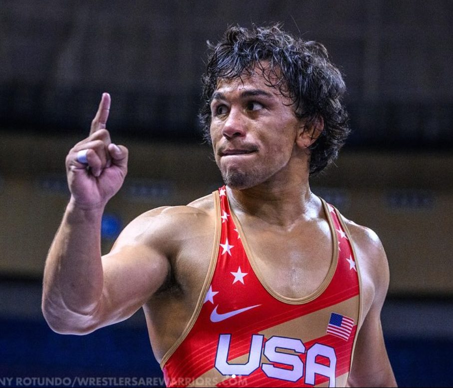 Peyton Omania celebrating a win in a Team USA singlet